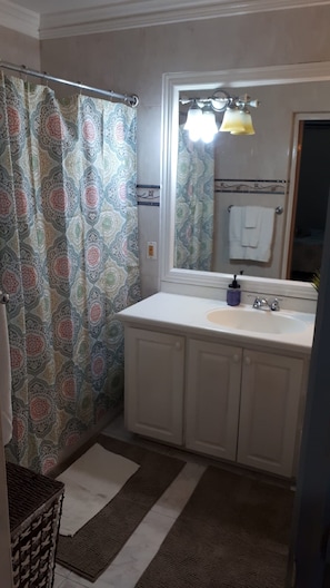 Combined shower/tub, hair dryer, towels, toilet paper