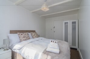 Ropa de cama de alta calidad y tabla de planchar con plancha