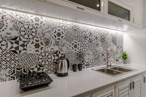 Fridge, microwave, cookware/dishes/utensils, dining tables