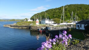 A coastal marina with boats docked, a lighthouse, and a small building labeled "Sea Lock Office". - Peaceful Farm Cottage in the 'Heart of Argyll' over-looking Loch Awe (Dalmally)