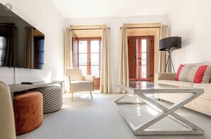 Deluxe Apartment, 2 Bedrooms | Living area | Flat-screen TV