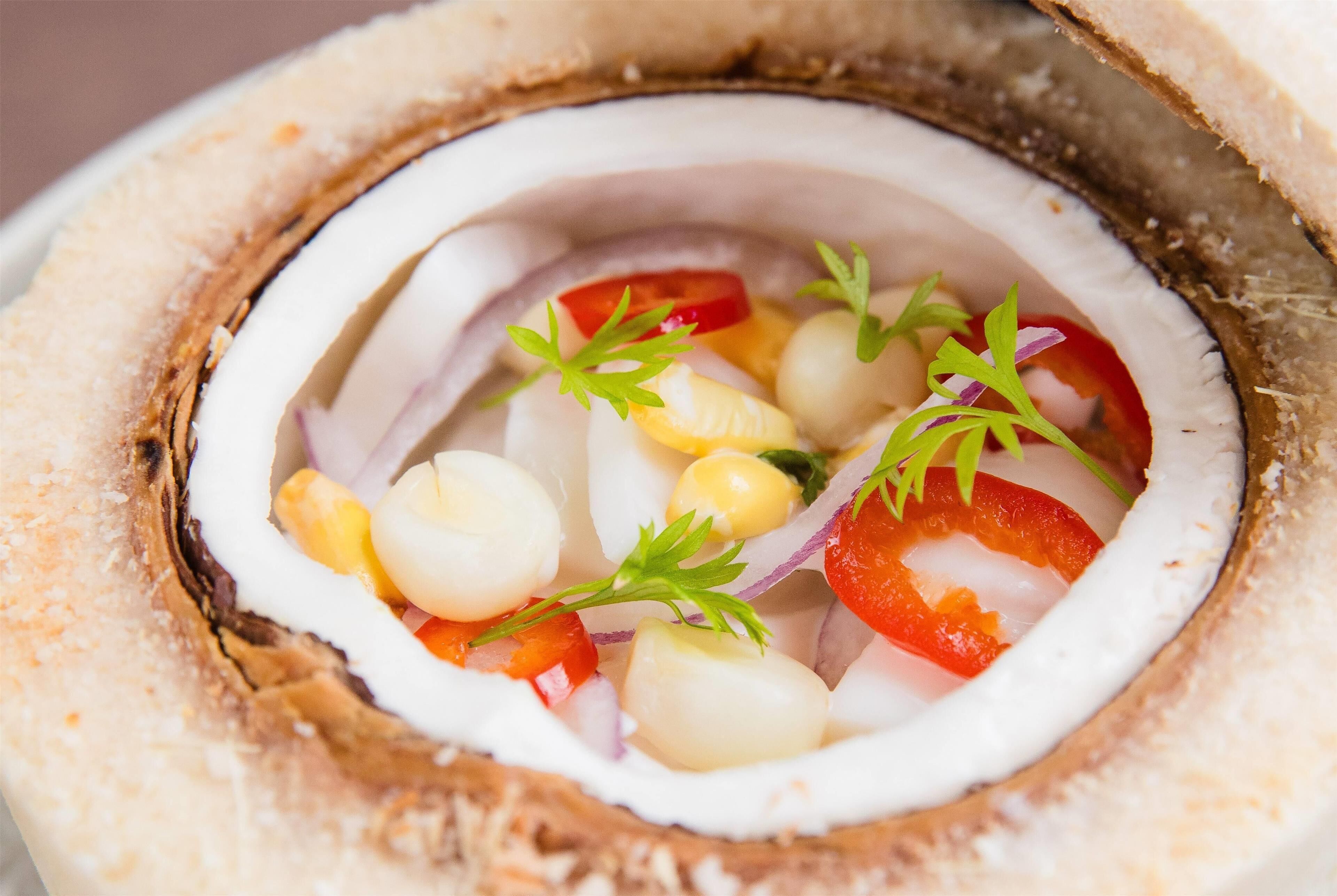 A close-up of a seafood dish with various ingredients.