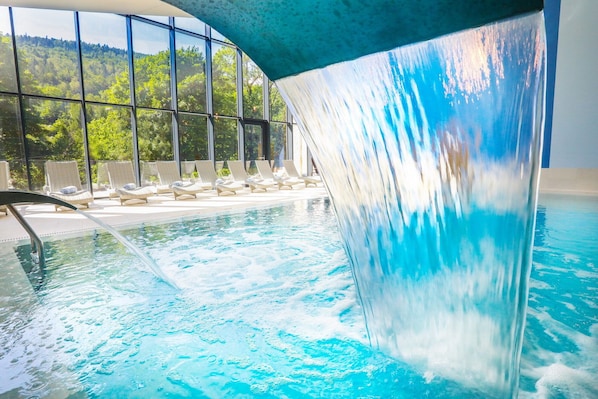 Indoor pool, open 9:00 AM to 9:00 PM, pool loungers, lifeguards on site