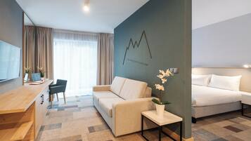 Premium bedding, desk, laptop workspace, blackout curtains