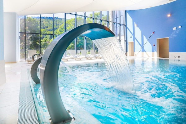 Indoor pool, open 9:00 AM to 9:00 PM, pool loungers, lifeguards on site