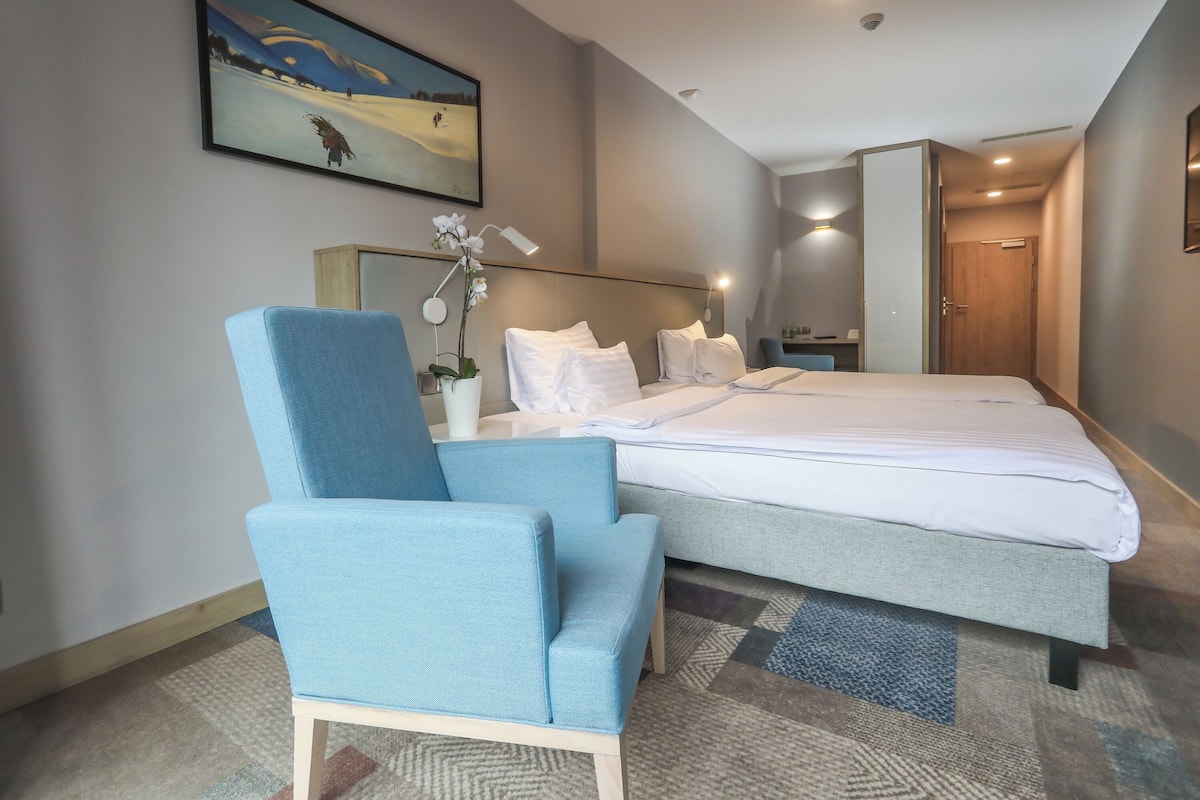 Twin | Premium bedding, desk, laptop workspace, blackout drapes