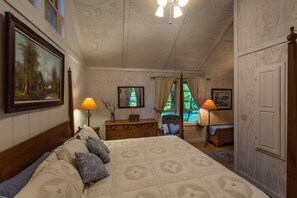 Cozy retreat with a large bed, dresser, and nightstand, perfect for a restful stay.