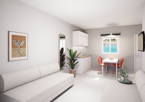 A modern living room with a sofa, a dining table with chairs, a kitchen area, and a view of a pool. - Melitti Lucent (Rethymno)