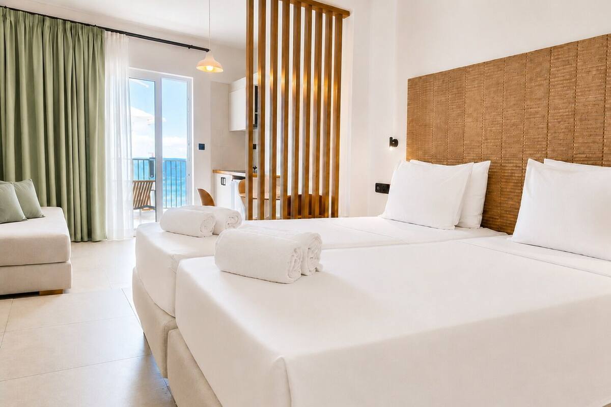 Superior Studio with Sea View and Balcony | In-room safe, desk, laptop workspace, blackout drapes