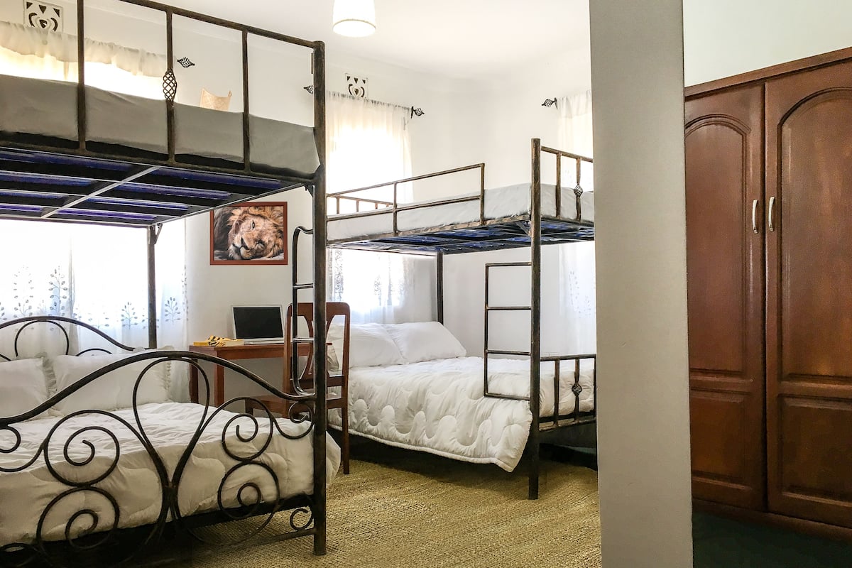 Family Quadruple Room, Multiple Beds, Private Bathroom, Ground Floor | 4 bedrooms, desk, iron/ironing board, free WiFi