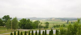Escape to our romantic stone cottage by a pond overlooking Amish country