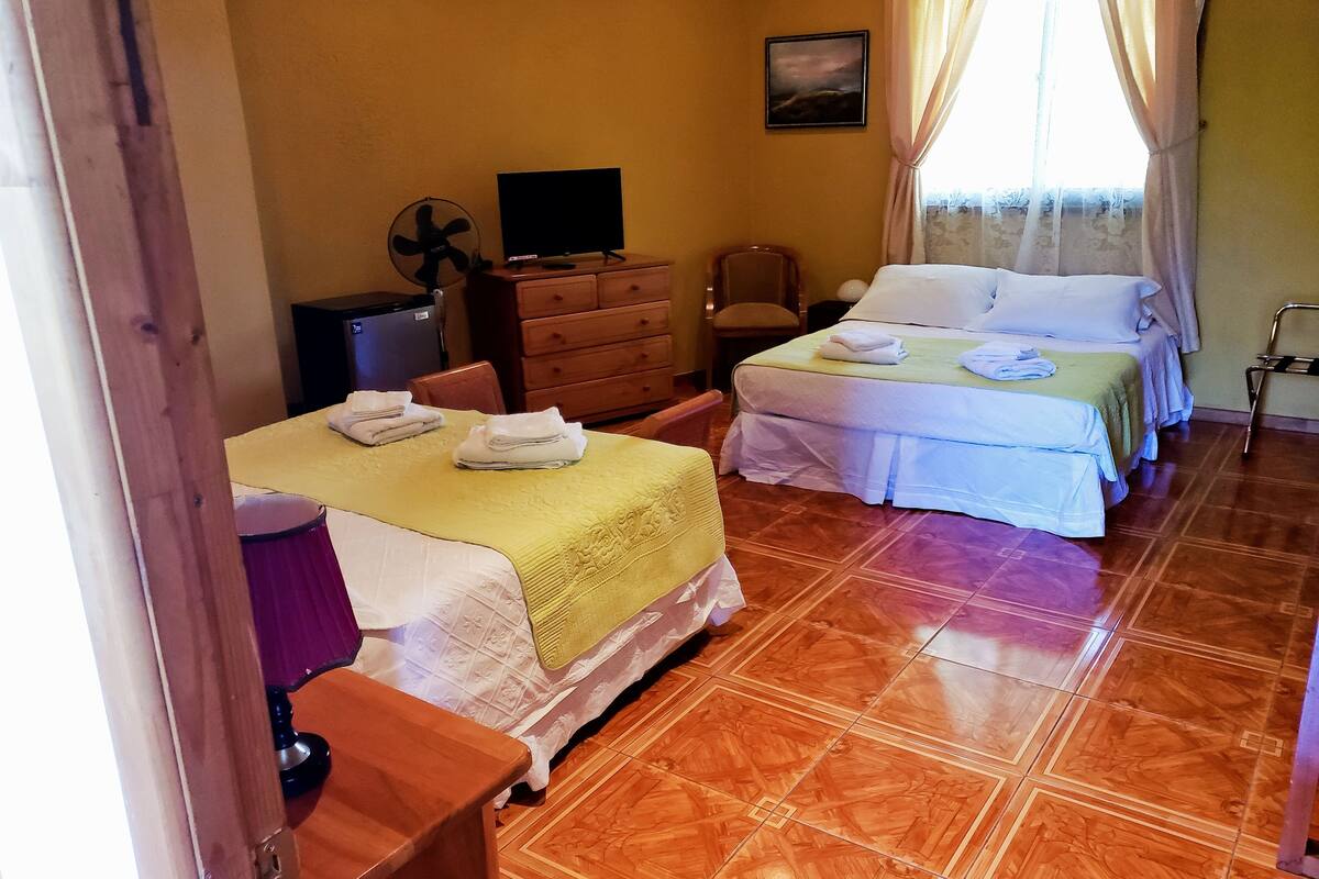 Family Room, Garden View | Minibar, in-room safe, WiFi (free), bed sheets