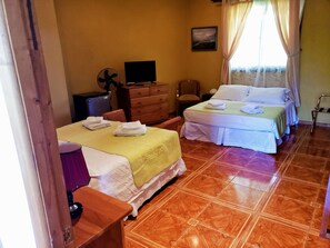 Family Room, Garden View | Minibar, in-room safe, free WiFi, bed sheets