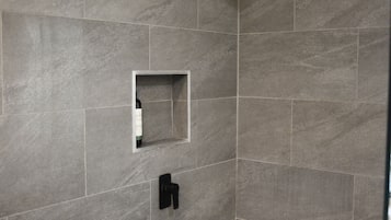 Bathtub, hair dryer, towels, soap