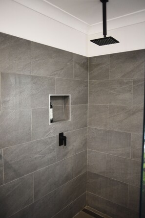 Bathtub, hair dryer, towels, soap