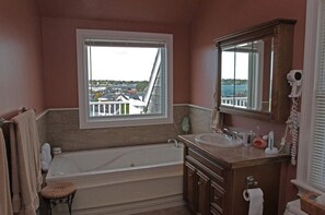 Combined shower/tub, hair dryer, towels, toilet paper