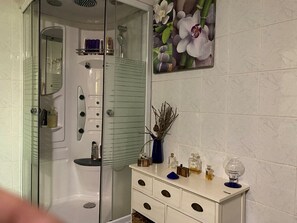 Shower, hair dryer, towels, soap