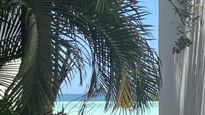 A pathway leading to a pool with a view of the ocean. - A pool and a beach… What else do you need? Check out my REVIEWS! GREEN! (BUCERIAS)