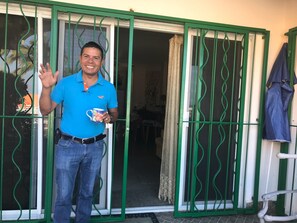 Guests can enjoy an entrance with a sliding glass door.