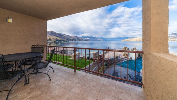 A balcony with a view of a lake and mountains. - GrandView 200 - Luxury Waterfront condo (Chelan)