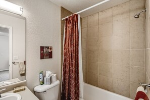 Combined shower/bathtub, hair dryer, towels, soap