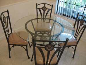 Enjoy meals in this stylish dining area with a round table and four comfortable chairs.
