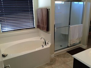 Combined shower/tub, hair dryer, towels, soap