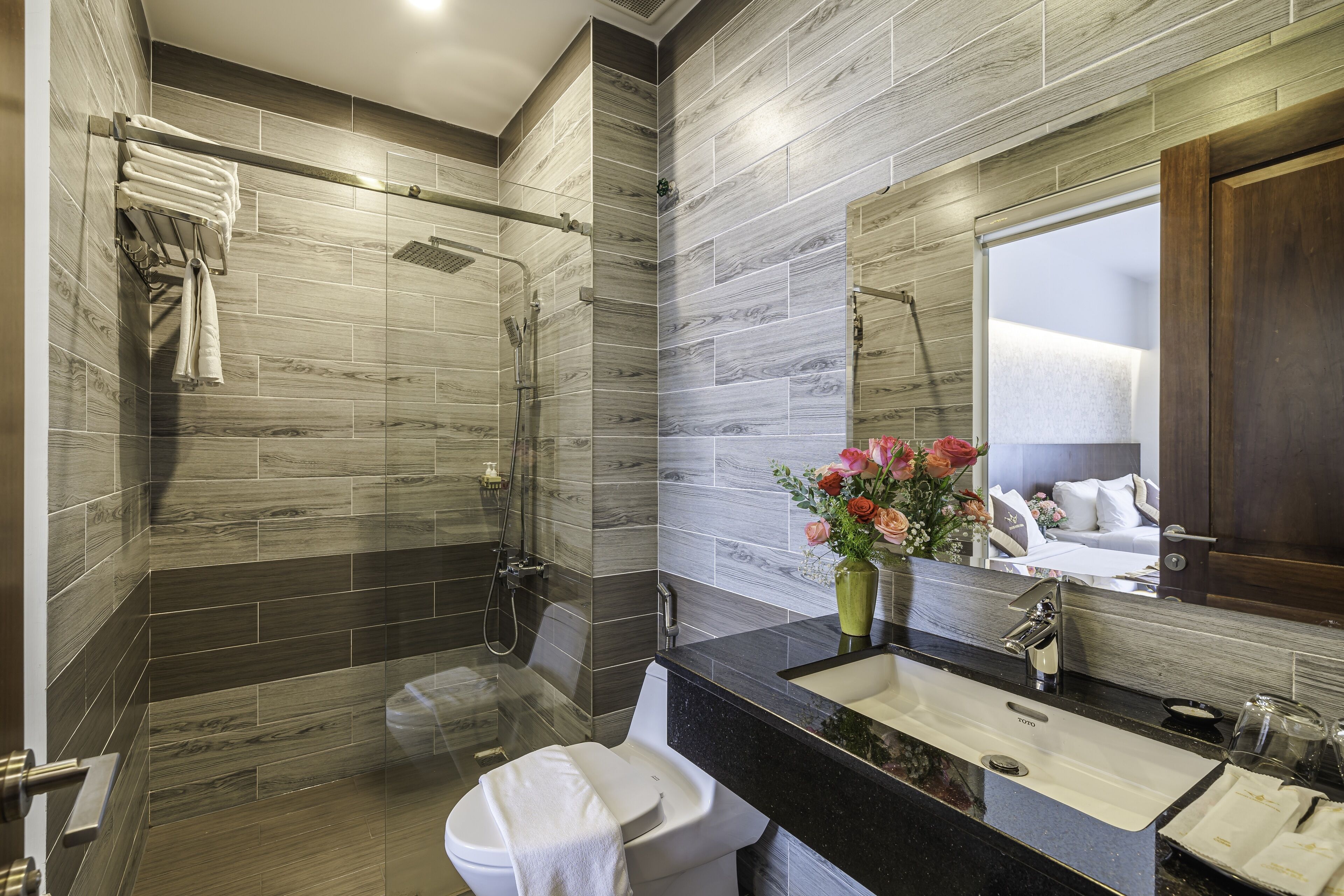 family room | bathroom | shower, rainfall showerhead, hair dryer, slippers