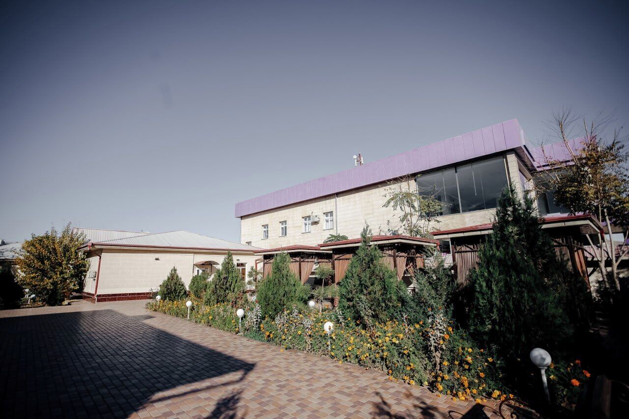 A modern building with a purple roof and large windows.