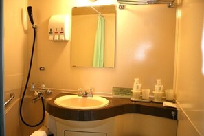 Combined shower/tub, deep soaking tub, free toiletries, slippers