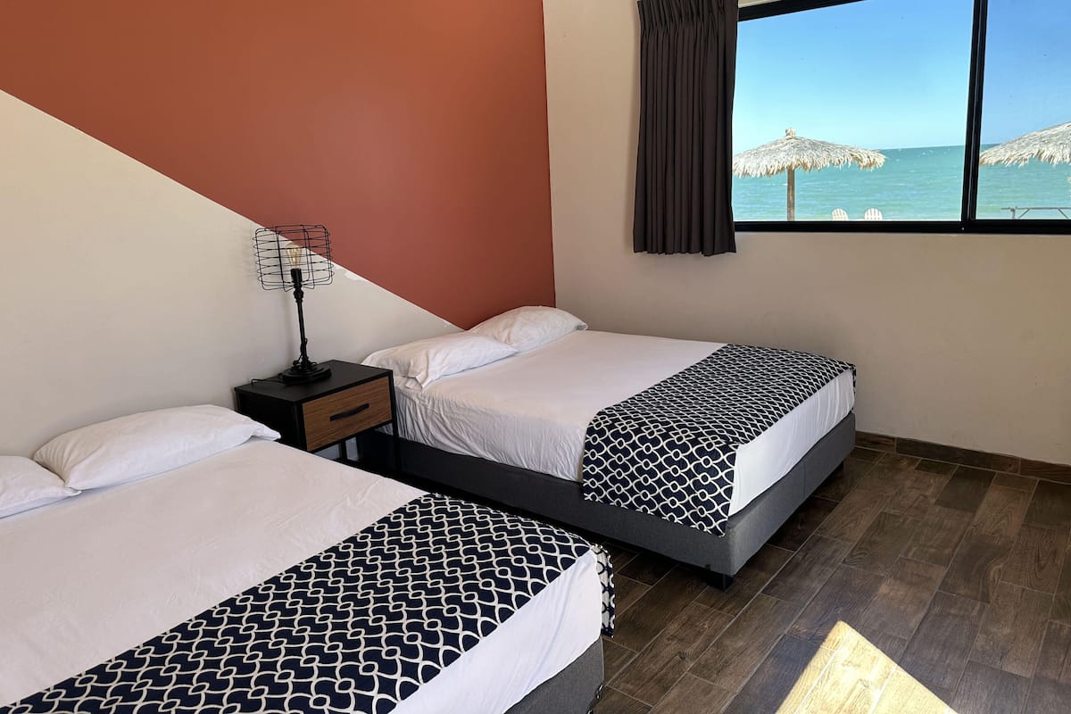 Standard Double Room, 2 Double Beds, Non Smoking, Beach View | 1 bedroom, desk, iron/ironing board, bed sheets