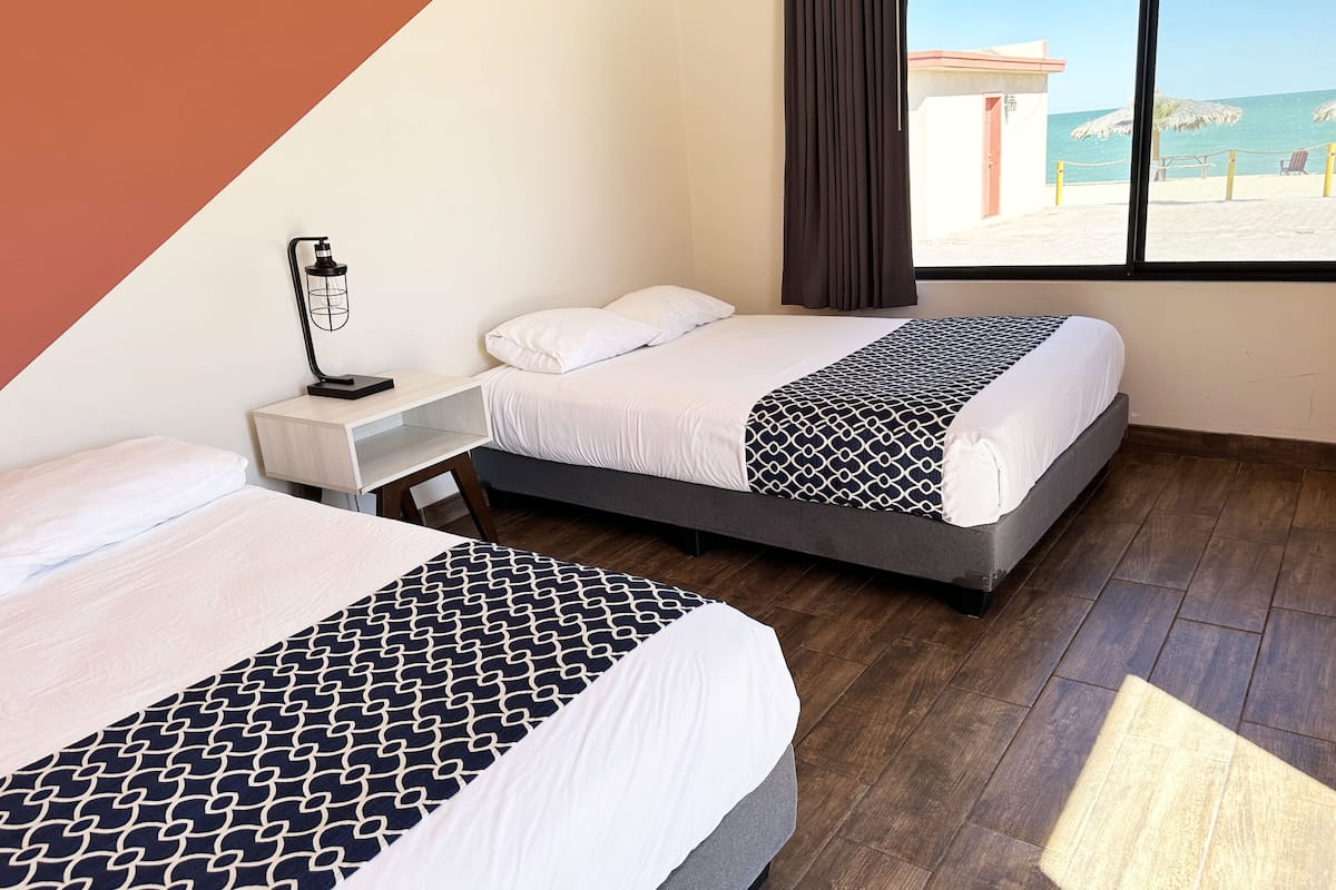 Standard Double Room, 2 Double Beds, Non Smoking, Sea View | 1 bedroom, desk, iron/ironing board, bed sheets