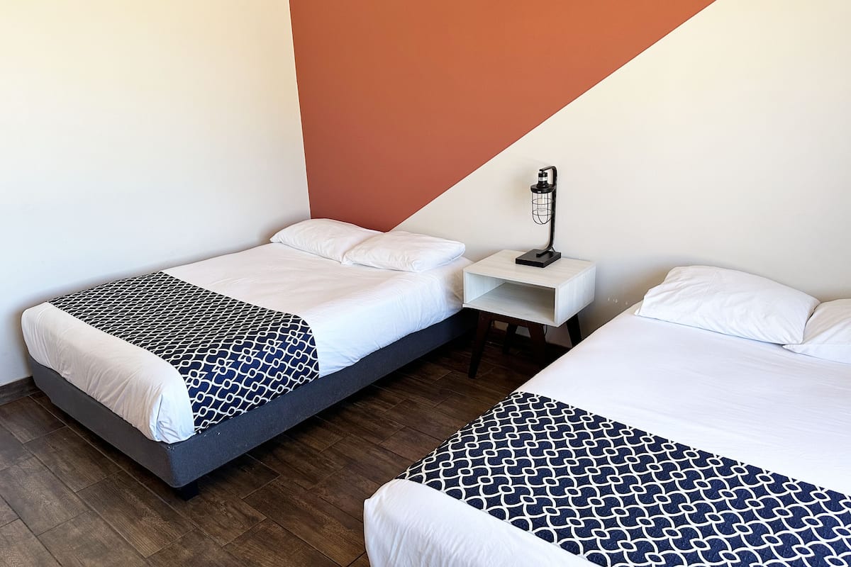 standard double room, 2 double beds, non smoking, sea view | 1 bedroom, desk, iron/ironing board, bed sheets