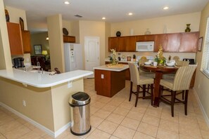 Family Villa, Garden Area | Shared kitchen | Fridge, microwave, oven