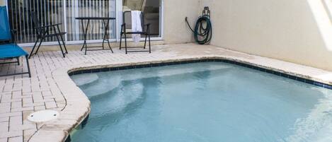 Seasonal outdoor pool, pool umbrellas, pool loungers