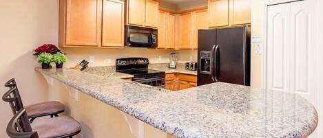 Family Villa, Garden Area | Shared kitchen | Fridge, microwave, oven