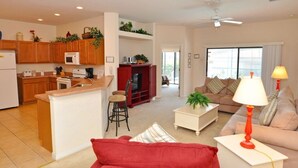 A modern apartment with a kitchen, living room, and dining area.