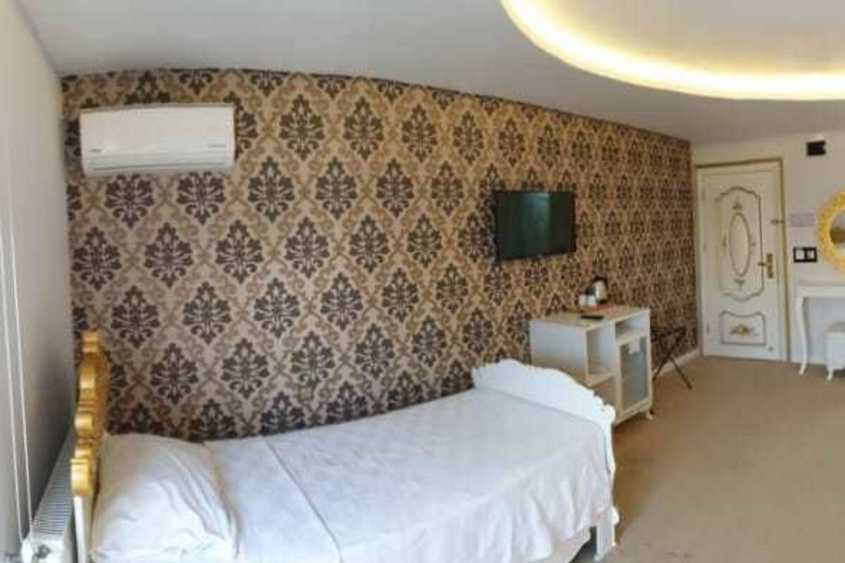 Habitación Deluxe | Ropa de cama de alta calidad, minibar, escritorio y wifi gratis