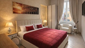 A hotel room with a large bed, a chair, a nightstand, a lamp, a painting of the Colosseum, and a window with curtains. - Rome Central Rooms Guest House (Rome)