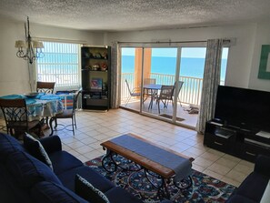Flat-screen TV, DVD player, books