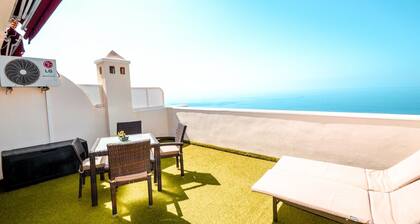APARTMENT A few meters from a black sand beach.
