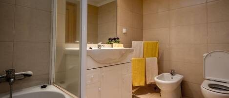 Combined shower/tub, jetted tub, hair dryer, bidet