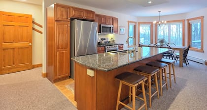 Spacious ski-in, ski-out 2-BR Jay Peak Village Condo, right on trail. A/C incl.!