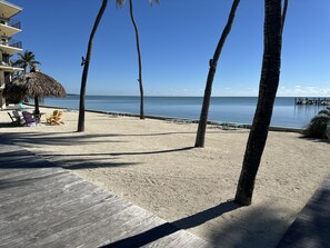 On the beach, sun loungers, beach towels