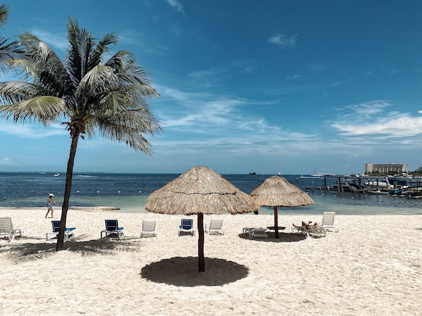 On the beach, sun-loungers, beach towels
