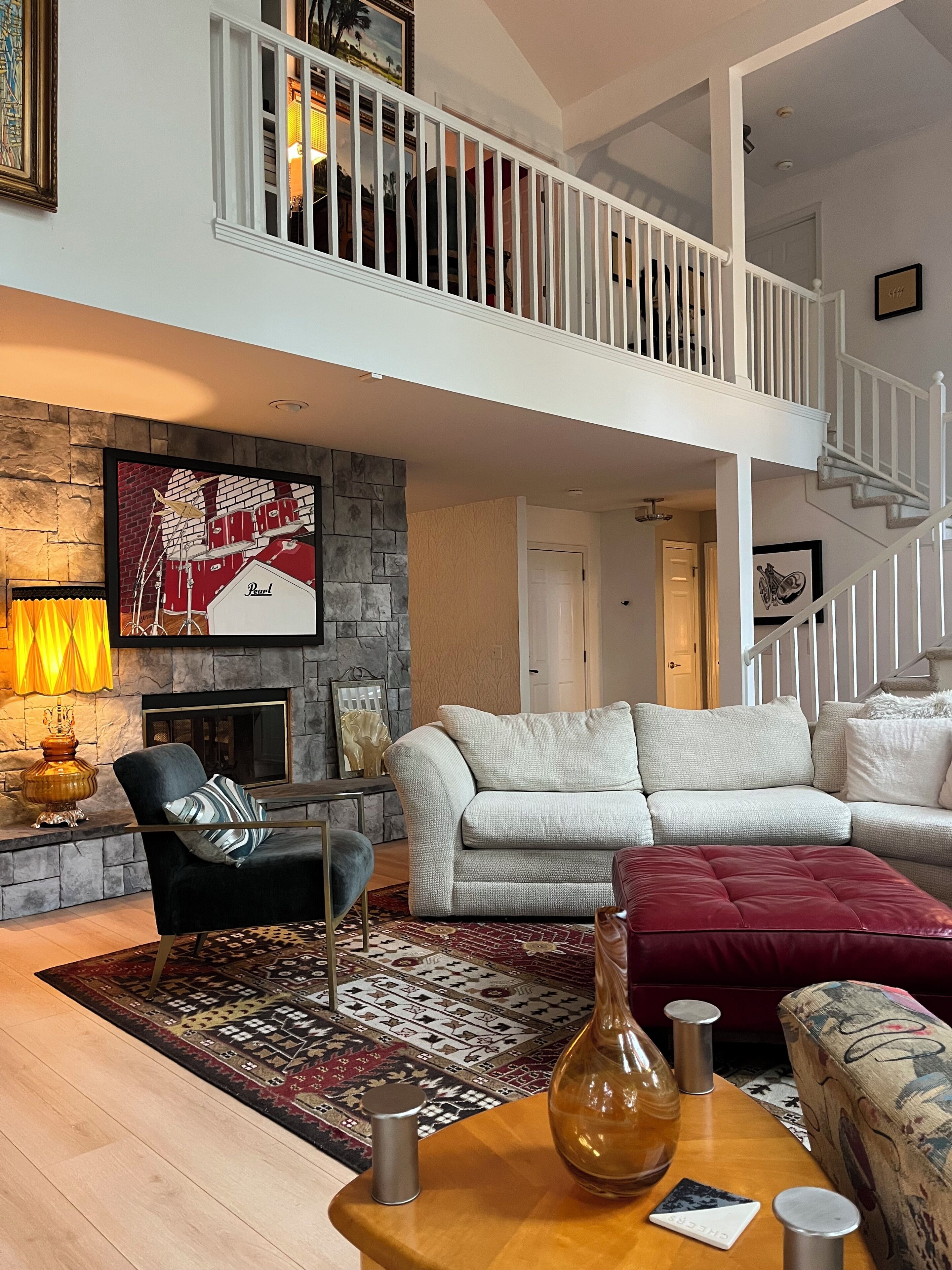 Smart TV, fireplace, books, printers