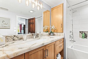 Combined shower/bathtub, hair dryer, towels, soap