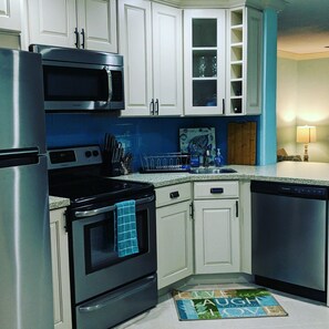 Microwave, dishwasher, coffee/tea maker, cookware/dishes/utensils