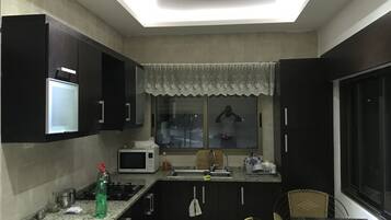 Departamento, 1 habitación | Cocina privada | Refrigerador, microondas, horno y parrilla de estufa