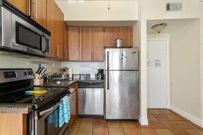 Comfort Apartment | Private kitchen | Full-sized fridge, microwave, oven, stovetop